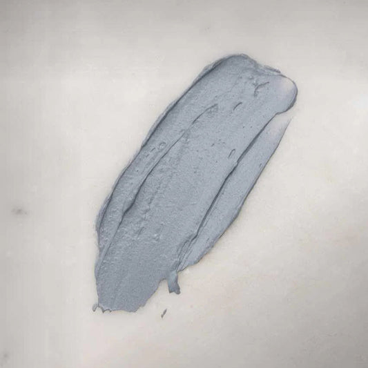 Close-up of creamy 2-in-1 purifying mask texture with smooth, non-drying finish