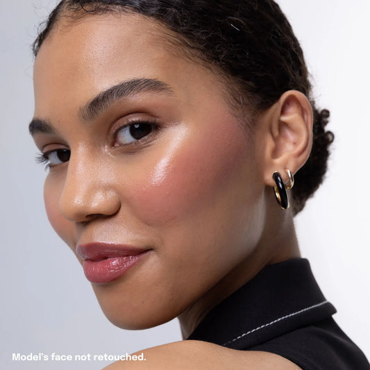 Model wearing Uoga Uoga cream blush in Posh shade on unretouched skin