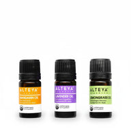 Alteya Organics essential oils mandarin lavender and lemongrass bottles on white background
