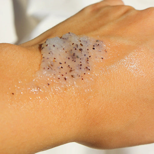 Close-up of a woman’s hand showing the texture of Clemence et Vivien body scrub