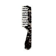 Black comb with tortoiseshell pattern on a white background