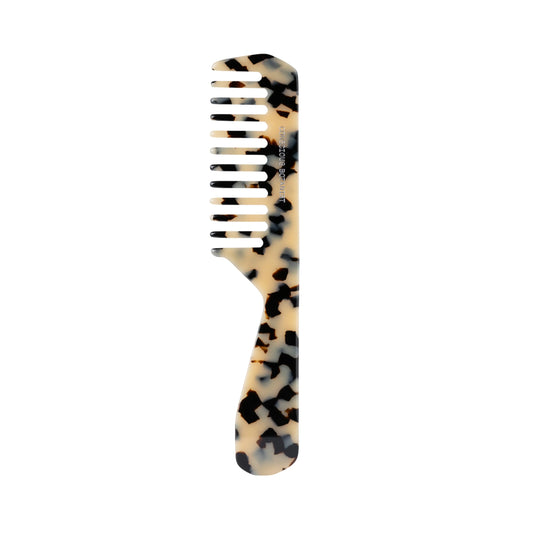 Tortoiseshell-patterned comb by Conscious Botanist on a white background