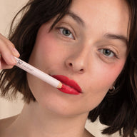 Woman with brown hair wearing Eclo 3-in-1 lip pencil Rouge Kiss 002