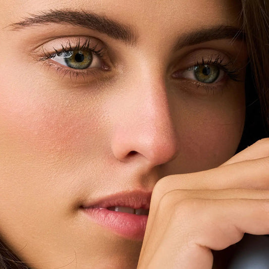 Close-up of woman wearing Eclo Black mascara showing defined lashes