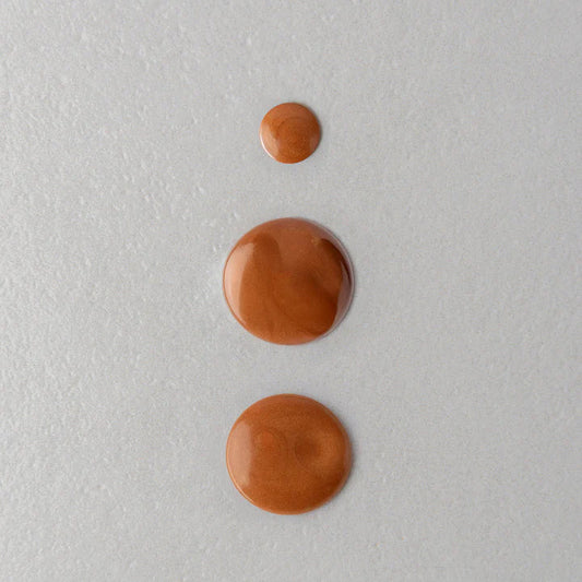 Macro texture of Twelve Beauty Glow Island Body radiance Oil 