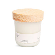 Hetkinen Archipelago candle in a glass jar with a wooden lid on a white background