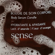 Body Serum Candle packaging with brown and white design