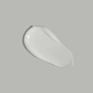 Texture of Jungkraut Alpine Performance Face Fluid displayed on a neutral background.