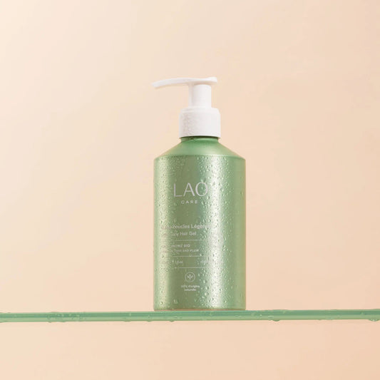 LAO CARE Light Curl Jelly green bottle with pump on a beige background