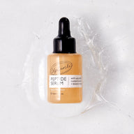 Upland Peptide Serum bottle on a textured white background