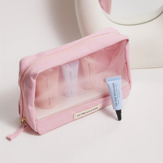 On The Wild Side discovery cosmetic bag with travel size skincare products on a light background