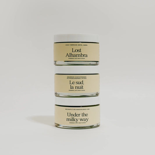 Three cylindrical containers with Refeel naturals body scrubs on a light gray background