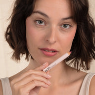 Woman with brown hair wearing Eclo 3-in-1 lip pencil Rose Velvet 004