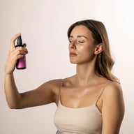 Woman holding a spray bottle of Rose Water Toner by Bepure against a plain background