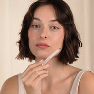 Woman with brown hair wearing Eclo 3-in-1 lip pencil Rosewood 005