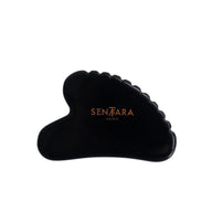 Black Obsidian gua sha tool with 'Setara' branding on a white background