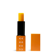 Uoga Uoga Spritzberry lip balm in open orange tube packaging