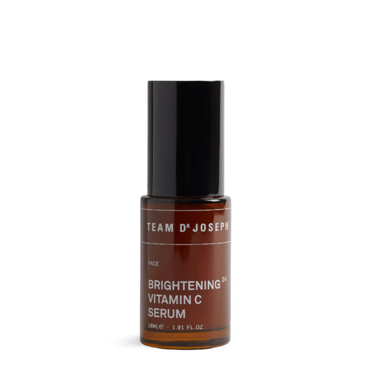 TEAM DR JOSEPH Brightening Vitamin C Serum 30 ml in an amber bottle with a black cap, on a white background