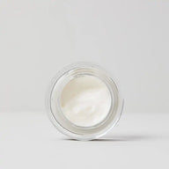 Top view of an open jar of TEAM DR JOSEPH Hyaluronic Lip Contour Cream showing its smooth white cream