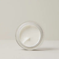 Top view of an open jar of TEAM DR JOSEPH Hyaluronic Repair Booster Cream showing its smooth white cream