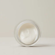 Top view of an open jar of TEAM DR JOSEPH Supreme Well Aging Cream showing its smooth white cream