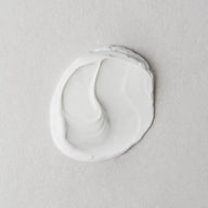 Twelve Beauty Artemisia Power Protection Moisturiser SPF50 creamy texture swatch on a gray background