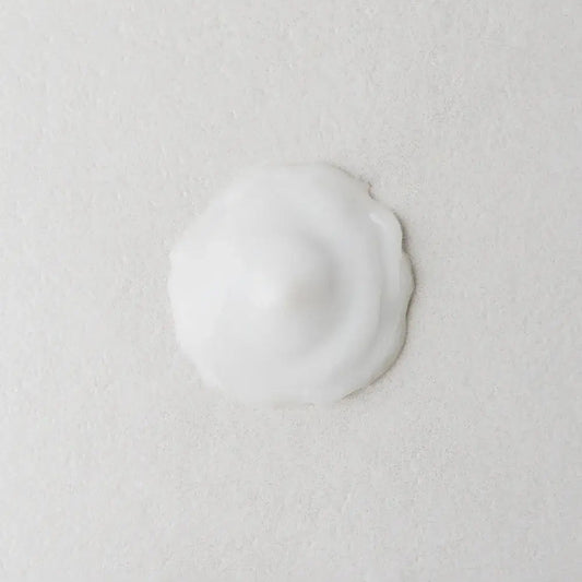 Twelve Beauty Prebiotic Natural Shine Conditioner texture swatch on a light gray background