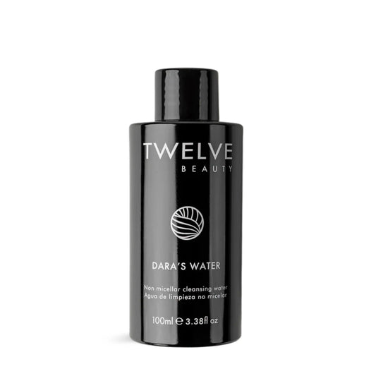 Black bottle of Twelve Beauty Dara's Water on a white background