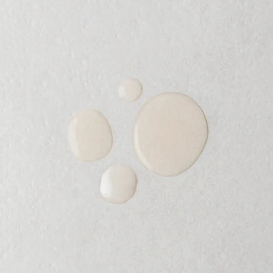 Twelve Beauty The Scalp Cure texture swatch on a gray surface