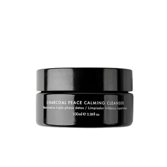 Twelve Beauty Charcoal Peace Calming Cleanser in a black glass jar and a cap displayed on white background