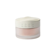 Uoga Uoga frosted glass cosmetic jar with Peachy blush powder. The product inside has a soft, pale pink color visible through the frosted container, set against a plain white background.