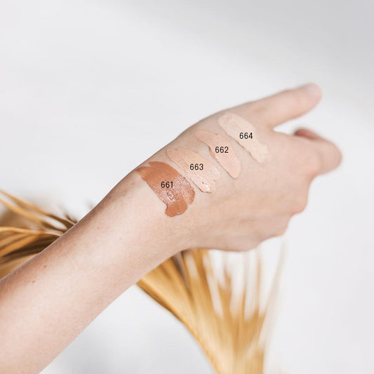 Swatches of Uoga Uoga BB Cream shades displayed on a woman’s hand.