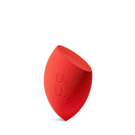 Red makeup sponge on a white background