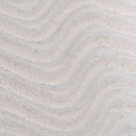 Close-up of Upcircle Powder to Foam Face Wash texture with subtle wave patterns