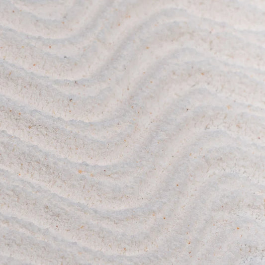 Close-up of Upcircle Powder to Foam Face Wash texture with subtle wave patterns
