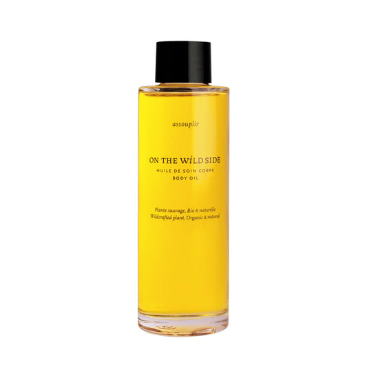 On The Wild Side Huile de soin Corps in a transparent glass bottle with a black cap displayed on white background