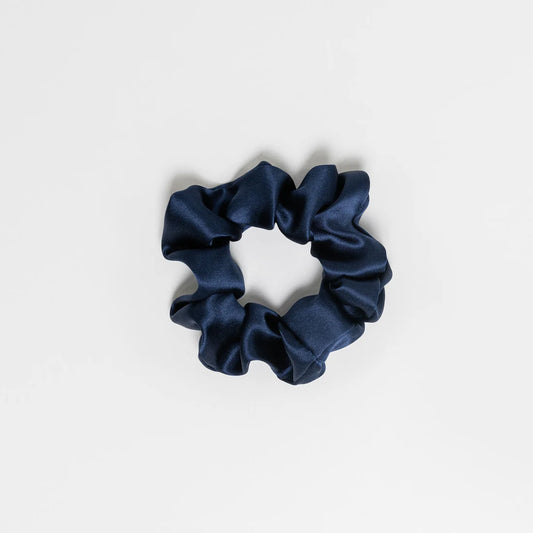 Hydra studio navy blue scrunchie on a light grey background